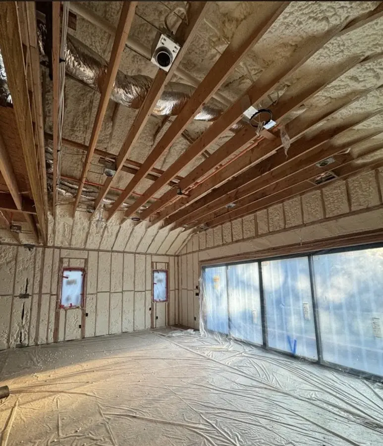 Interior walls and ceiling insulated with spray foam during new construction in Webster Groves
